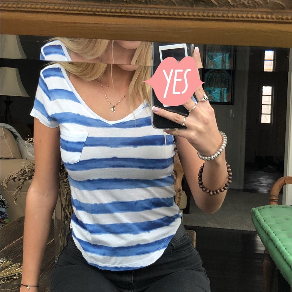 Short sleeve striped t-shirt with scooped bottom.